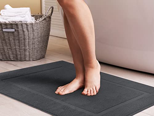 Grey cotton mat next to shower