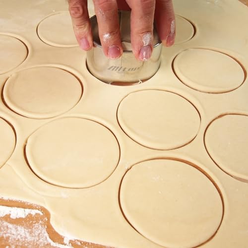 Three stainless steel round cookie cutters stacked
