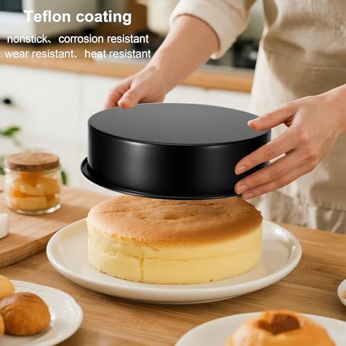Three black nonstick cake pans