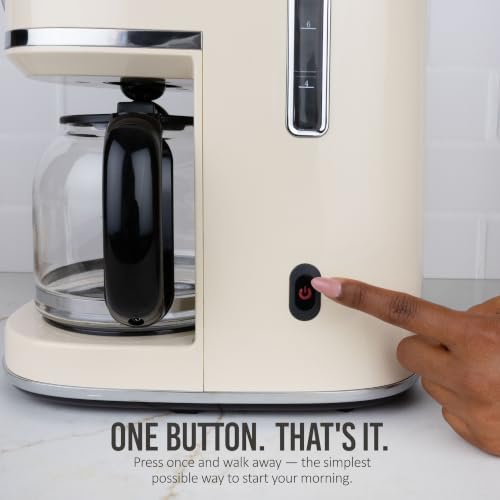 Close up of Nostalgia coffee maker brewing button
