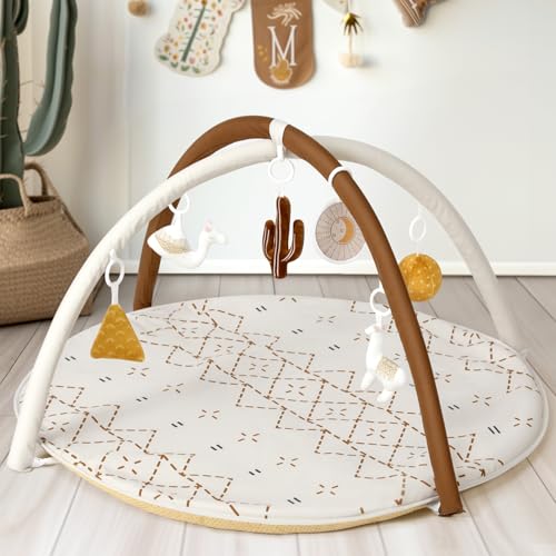 Baby interacting with little dove activity mat