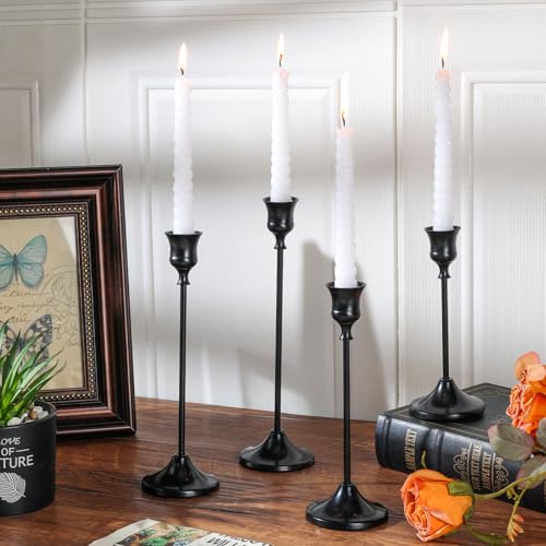 Tunyet candle holders displayed on a fireplace mantel