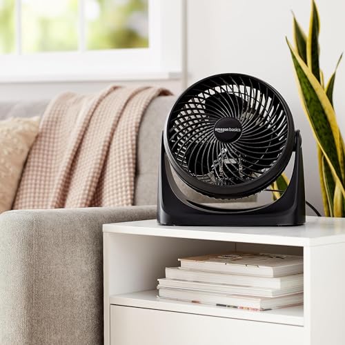 Compact desk fan sitting on an office surface