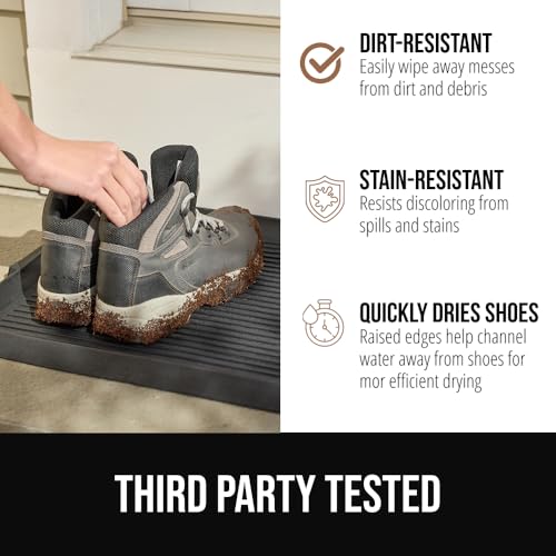 Durable rubber boot tray in a mudroom