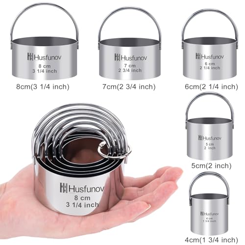 Five stainless steel cookie cutters with handles