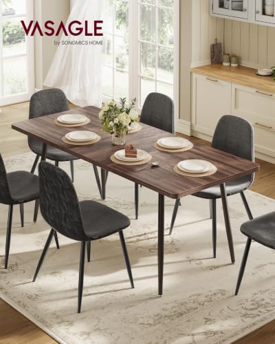 Close up of modern splayed steel table legs