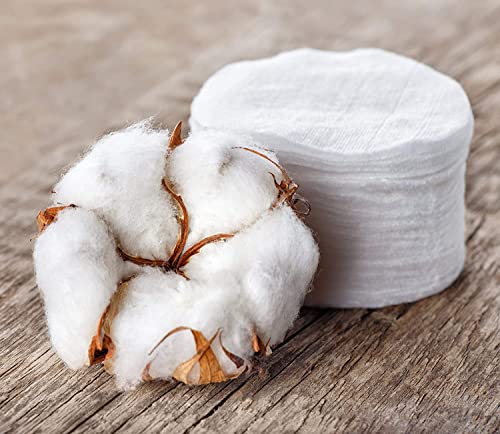Organyc cotton pads displayed next to cosmetic containers