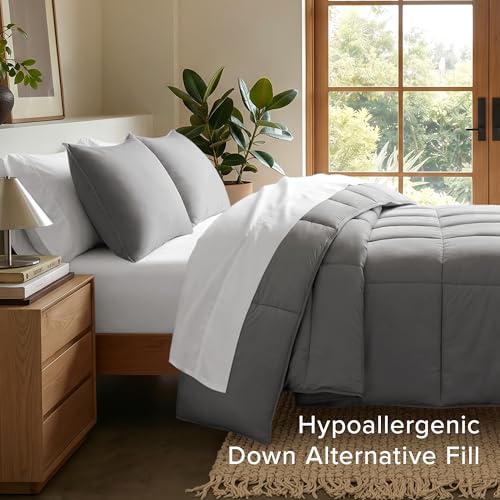 Grey comforter displayed on a twin size bed