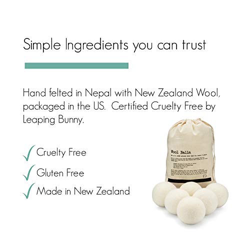 Hand-felted white wool dryer balls in storage bag