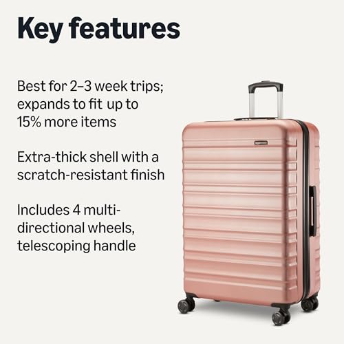 Side profile showing expandable zipper on rose gold suitcase
