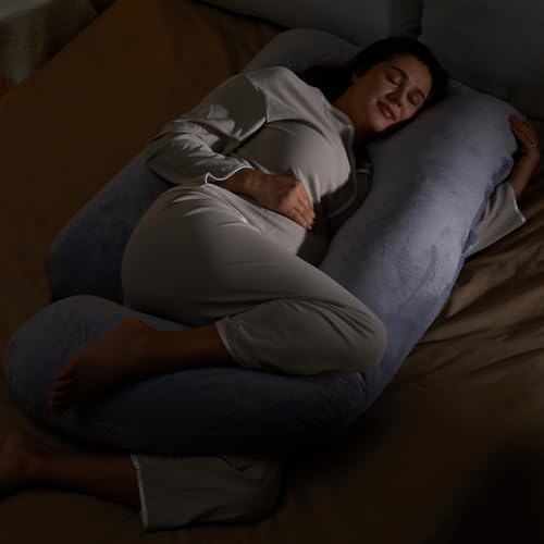 Momcozy U shaped pillow in a bedroom setting