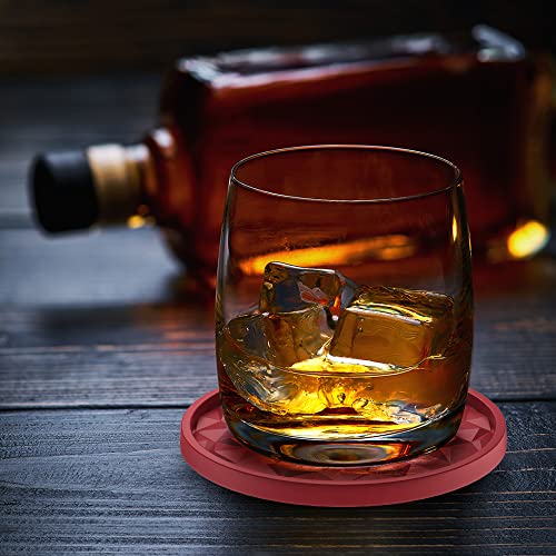 Individual black silicone coaster on a marble tabletop