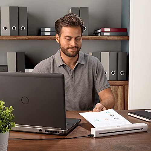 Compact Brother DS-640 unit next to a laptop