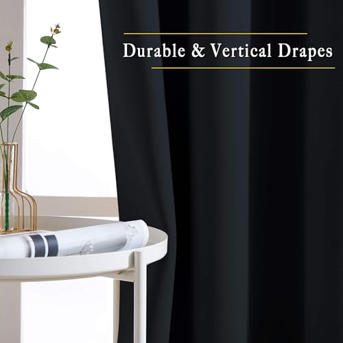 Bedroom window with black curtains