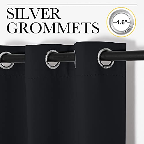 Black blackout curtains hung on rod