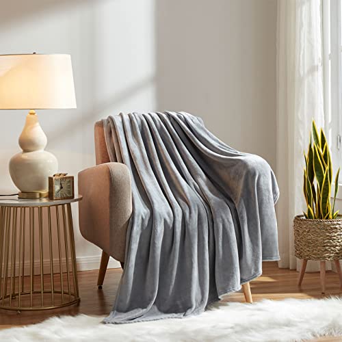 KMUSET throw blanket draped over a sofa
