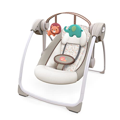 Ingenuity swing showing the removable toy bar with plush toys