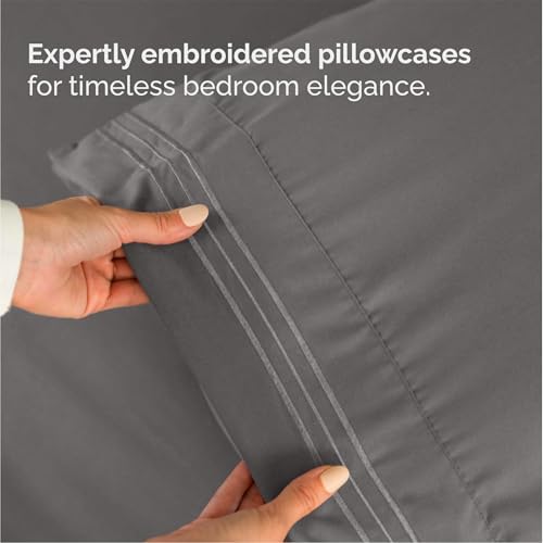 Dark grey bedding set styled on a queen bed