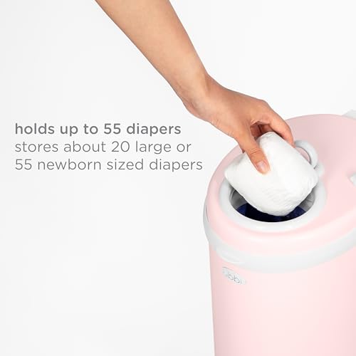 Ubbi diaper pail placed in a modern nursery