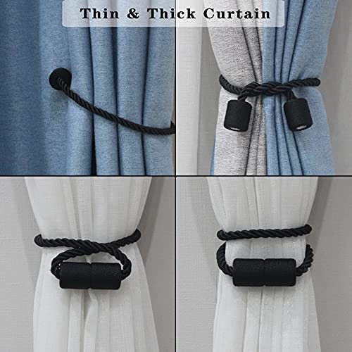 Two black magnetic curtain tiebacks