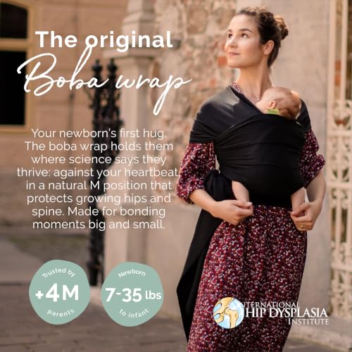 Boba Baby Wrap Carrier Black worn by parent