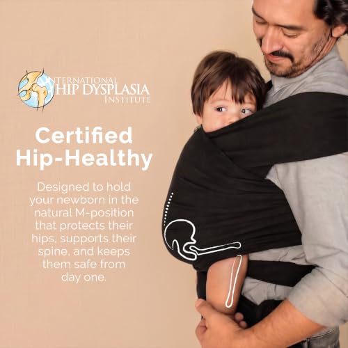 Parent wearing baby in black Boba wrap