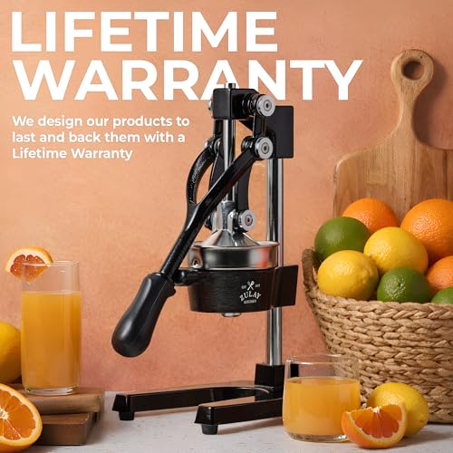 Citrus press extracting juice into a glass