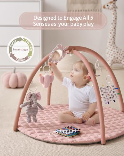 Pink baby activity mat with hanging sensory toys