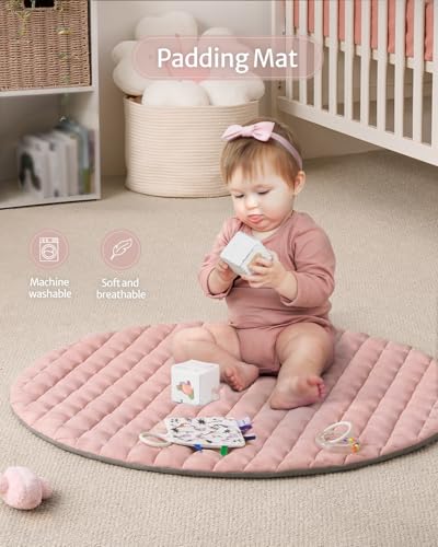 Soft pink nursery activity gym setup