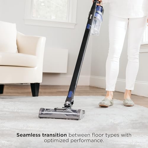 Shark cordless vacuum cleaning under furniture