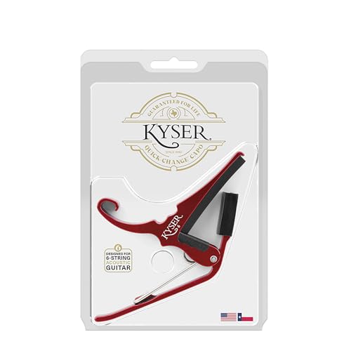Kyser guitar capo resting on headstock