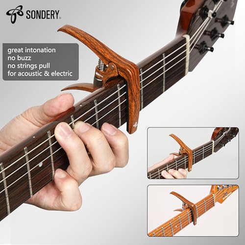 Sondery capo attached to guitar fretboard