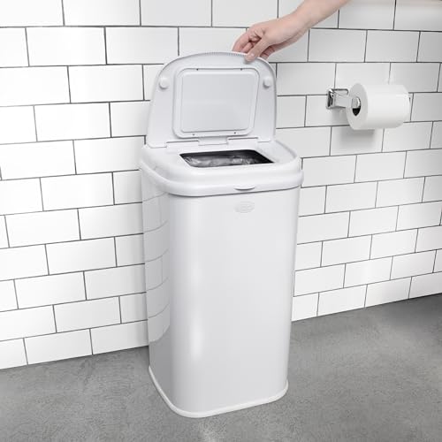 Ubbi Adult Diaper Pail in a bedroom setting