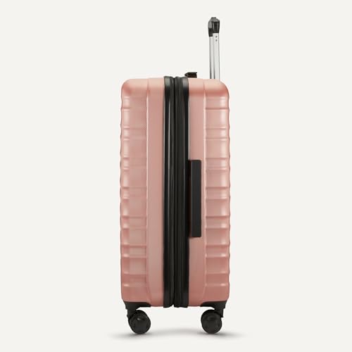 Close up of Basics rose gold luggage wheels and exterior finish