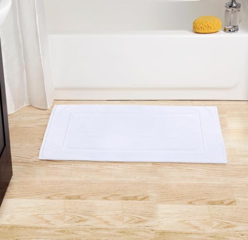 Folded white bath mats