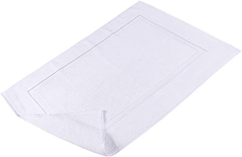 White bath mat on floor