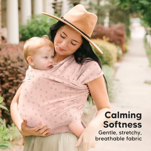Parent wearing baby in Pink Daisies wrap