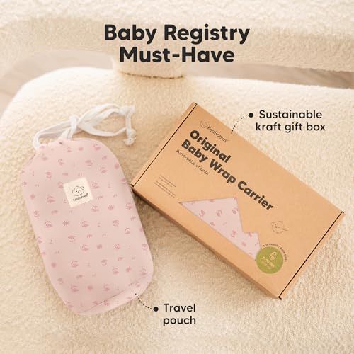 Newborn safely snuggled in Pink Daisies wrap