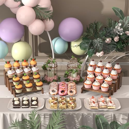 Dark brown wood risers arranged on a dessert table