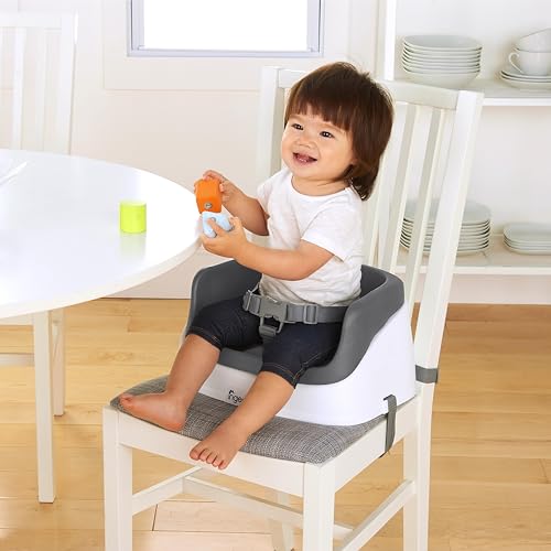 Booster seat attached to dining chair
