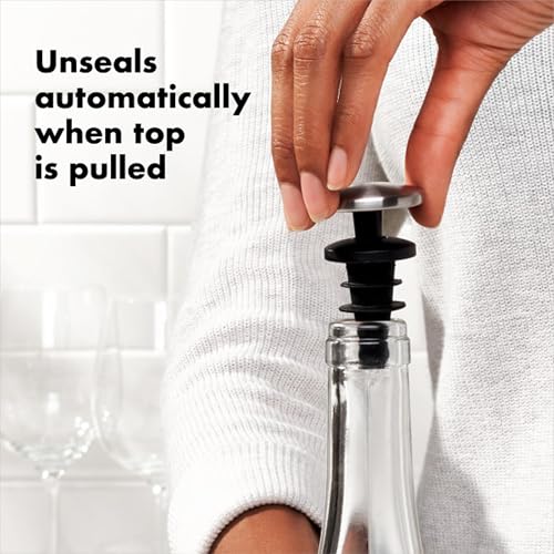 Two OXO wine stoppers on a kitchen surface