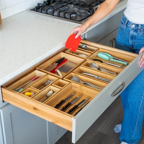 Kitchen junk drawer organized with bamboo trays