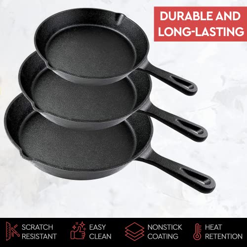 Three black cast iron pans of different sizes