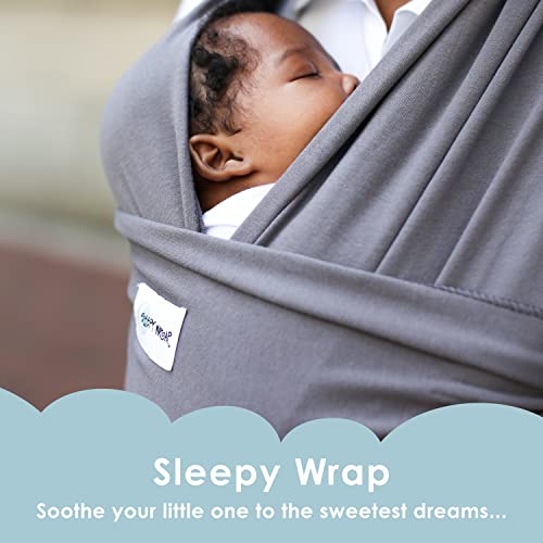 Parent wearing Sleepy Wrap newborn carrier