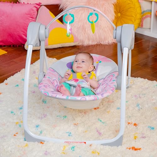 Folded Bright Starts baby swing for storage