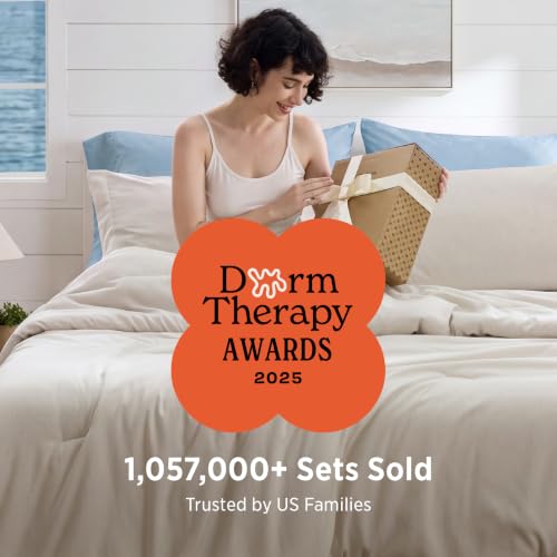 Beige Melange comforter draped on a bed