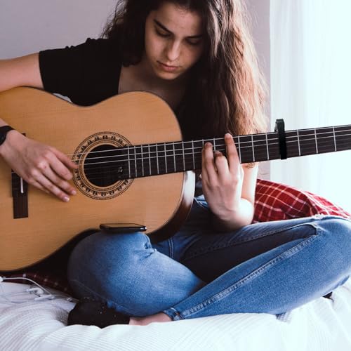 WINGO capo applied to acoustic guitar