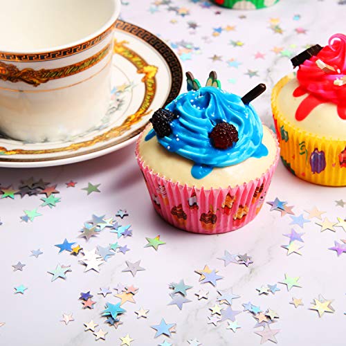 Holographic silver stars spread on a table