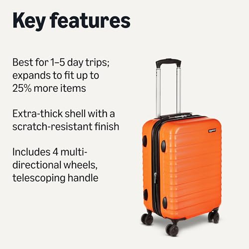 Side view of orange hardside carry-on luggage