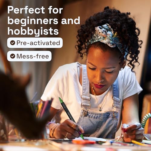 Artist using ARTISTRO pens for detailed craft